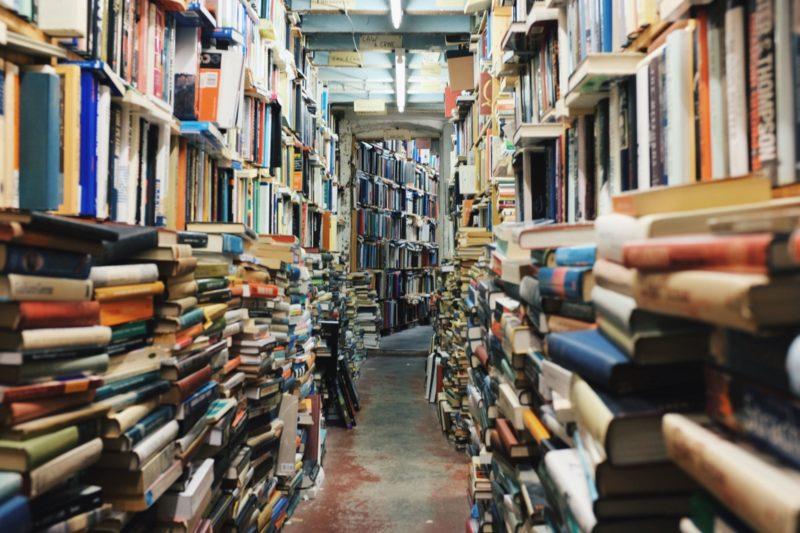 a crowded bookstore full of books, easy to get lost in