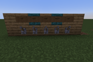 A Minecraft combination lock with five levers and signs above the levers. Students pull the levers for the right answers. If they get all of them right, a door opens